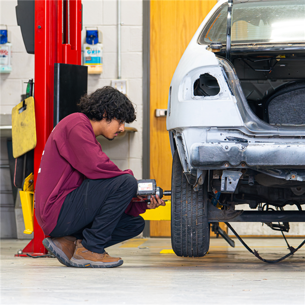 Automotive Technology student working on cars