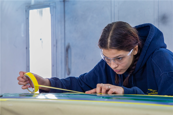 Collision Repair Technology students working on cars