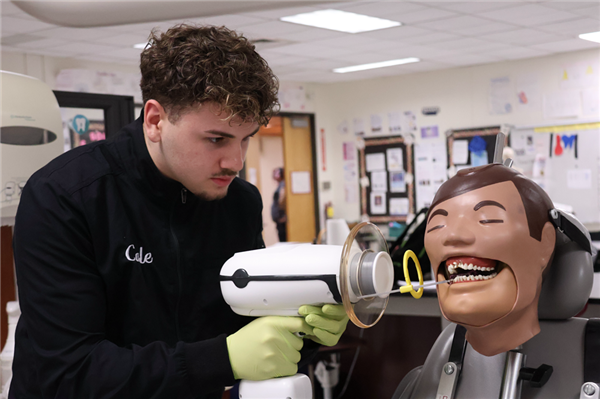 Dental Occupations student working on Patient