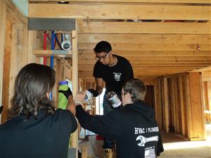 Team Work In Student Built House 