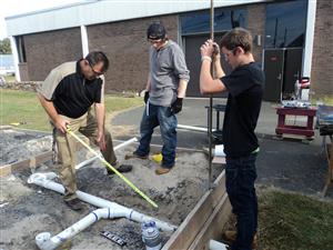 Students install DWV Piping 